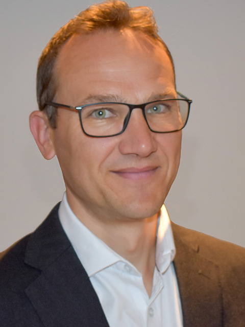 Portrait photograph of academic visitor to the School of Architecture, Building and Civil Engineering at Loughborough University, Nick Sartain